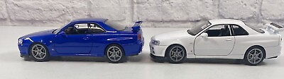 #ad *BRAND NEW* Welly 1:24 Lot Of 2 Diecast Cars Nissan Skyline GT R R34 Blue White $49.95