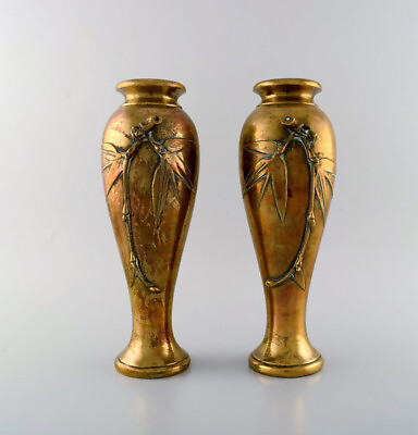 #ad A pair of French art nouveau bronze vases with flowers in relief. Ca. 1890 $840.00