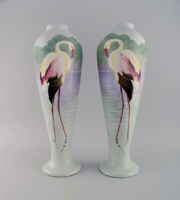 #ad A pair of large faience vases with hand painted flamingos and a lake pavilion. $1250.00