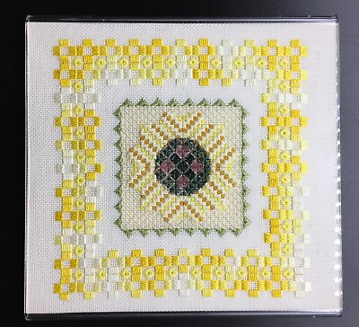 #ad Needlepoint in shades of yellow handwork completed and in 9” X 9” lucite frame $24.00