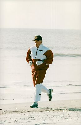 #ad Bill Clinton takes a springtur on the beach Vintage Photograph 671533 $13.90